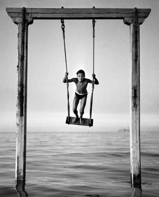 Cooke---boy-swinging-Rimini 1954